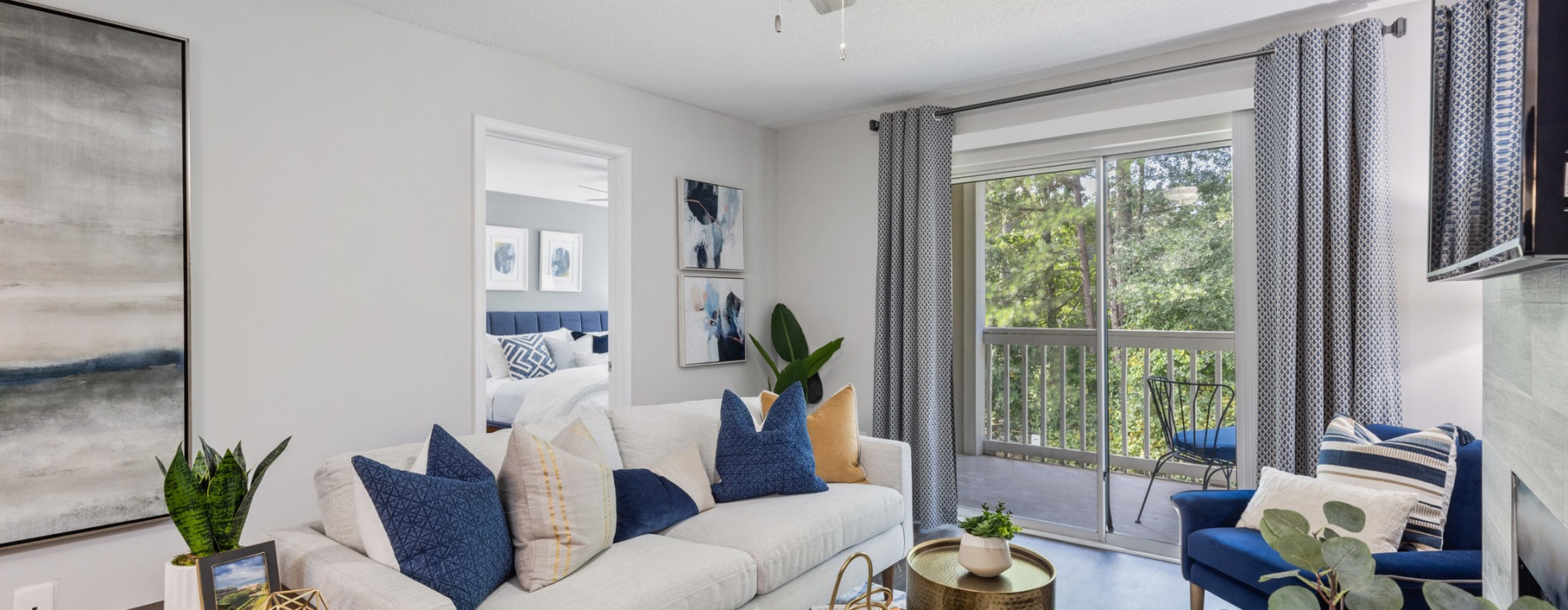 Living Room With Door To Balcony At The Victor Verdae Apartments